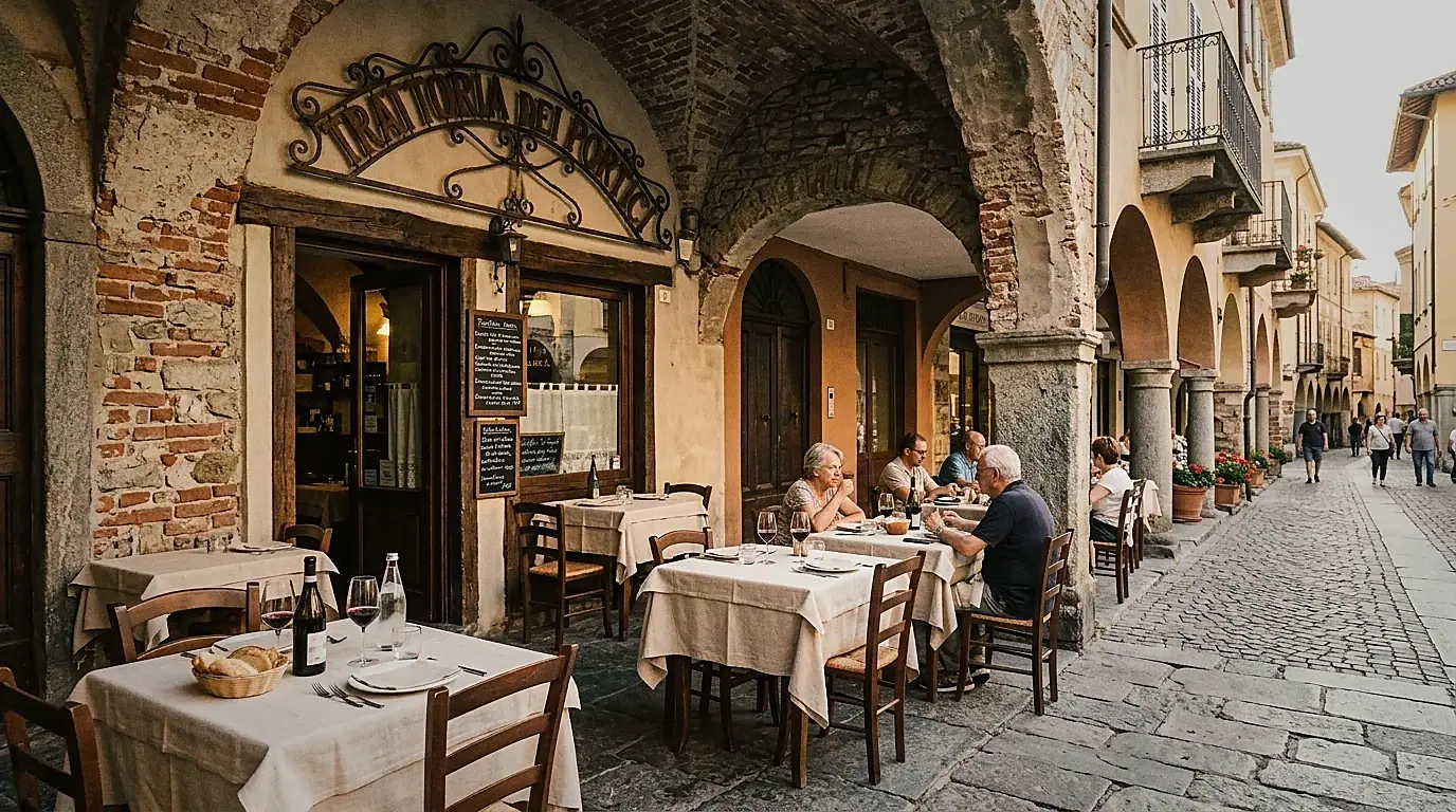 Facciata della Trattoria dei Portici sotto i portici storici di Canelli